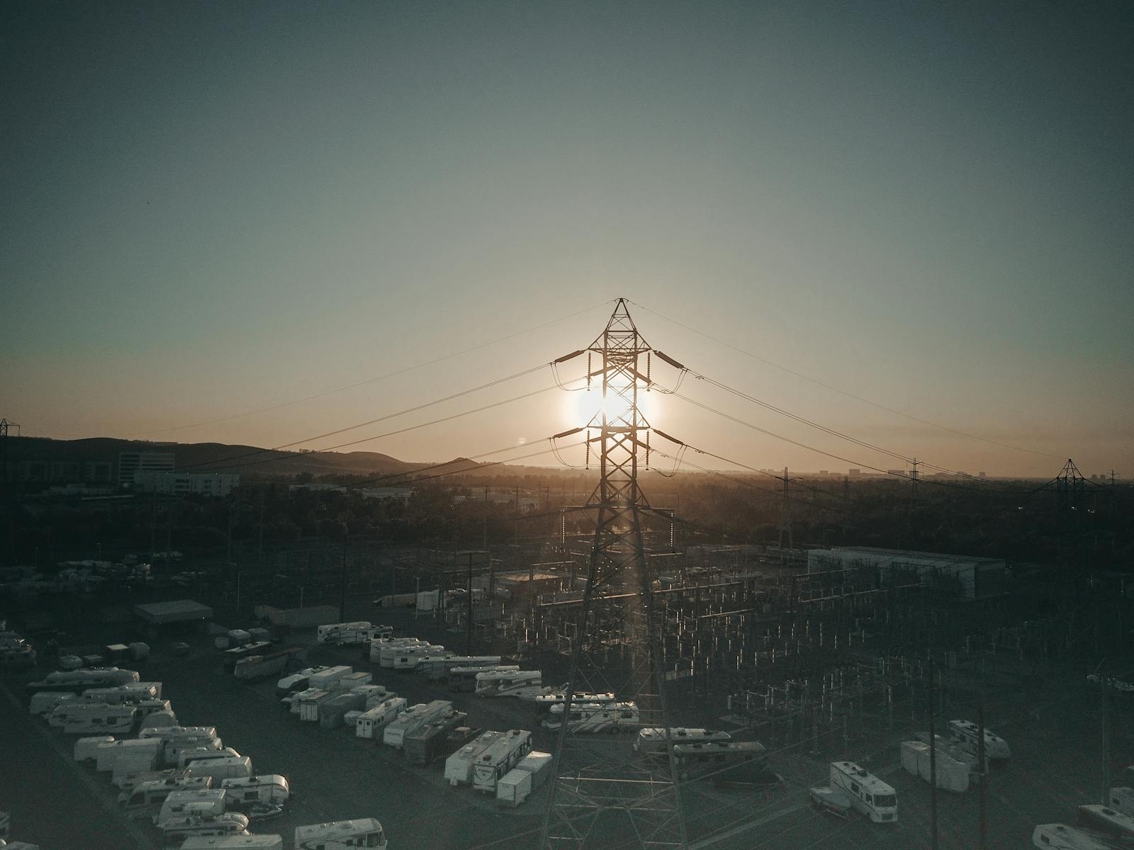 Transmission infrastructure and substation equipment at sunset
